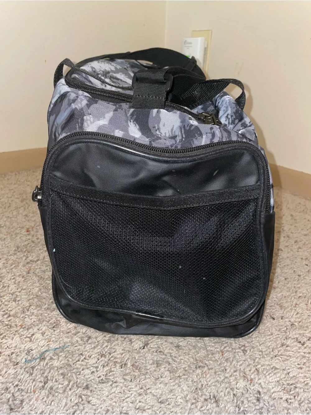Under Armour Men’s Gray Camo Duffel Bag with Red Logo